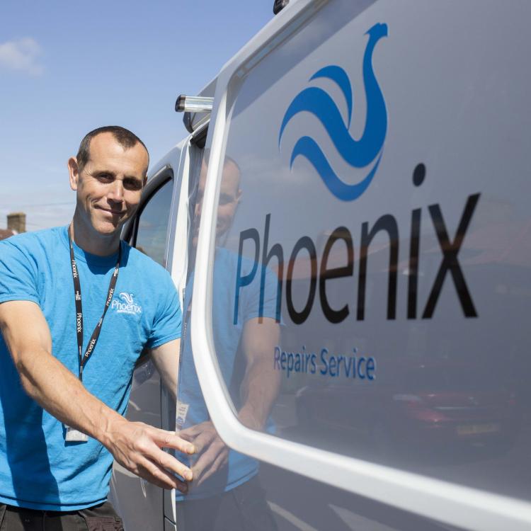 Phoenix Repairs Service staff and van