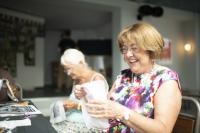 Photo of a resident taking part in embroidery as part of Phoenix's Threads of Fellowship group