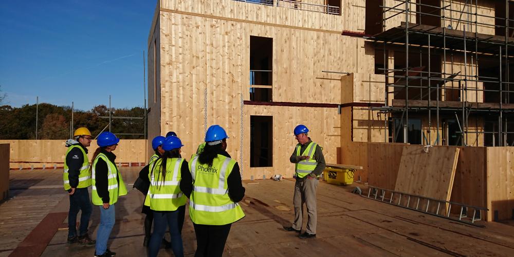 Photo of Phoenix Community Housing employees on the construction site at Nuthatch House